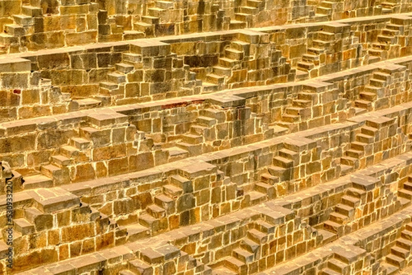 Fototapeta A panorama view across the giant Ancient Chand Baori Stepwell of Abhaneri