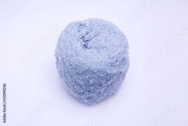 Fototapeta Home service thick wool coral fleece for crafts on white background with a clipping path