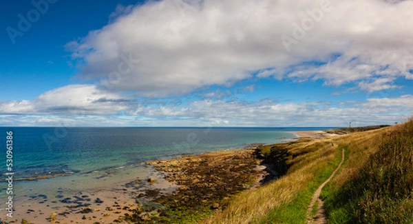 Obraz Covesea Skerries Lighthouse on the empty beach