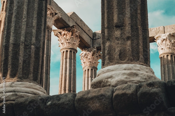 Fototapeta Évora, Portugal - 2022: 'Templo Romano de Évora'. Religious roman temple of Evora. UNESCO World heritage. Hexastyle and peripteran style.