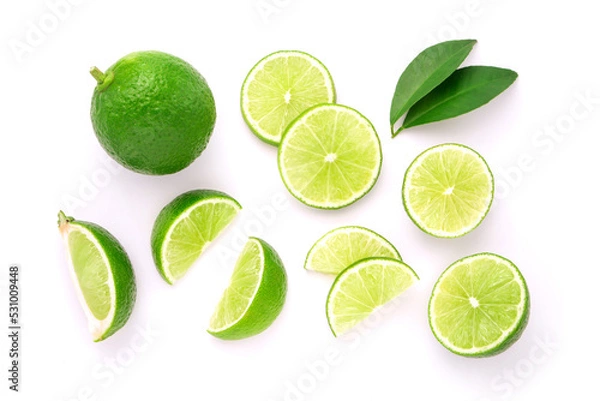 Obraz Lime with sliced and green leaf isolated on white background , top view , flat lay.