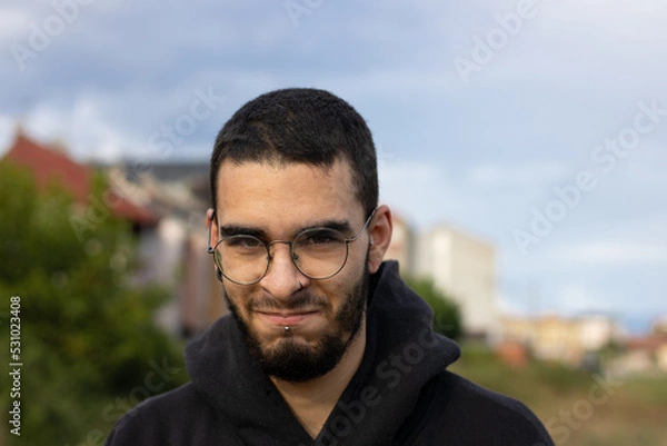 Obraz young man from side looking mischievous