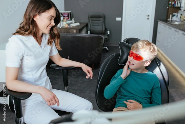 Obraz Young boy in dentistry with toothache