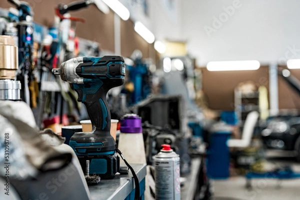Fototapeta Large workbench with tools at station for vehicle technical servicing