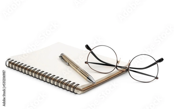 Fototapeta Notepad with pen and glasses on a white background.