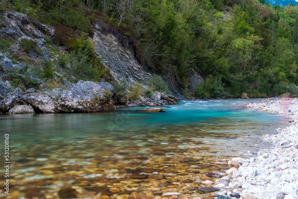 Fototapeta Colorful long exposure picture of emerald Soca (also known as Isonzo) River Valley at Julian Alps in Bovec, Slovenia	
