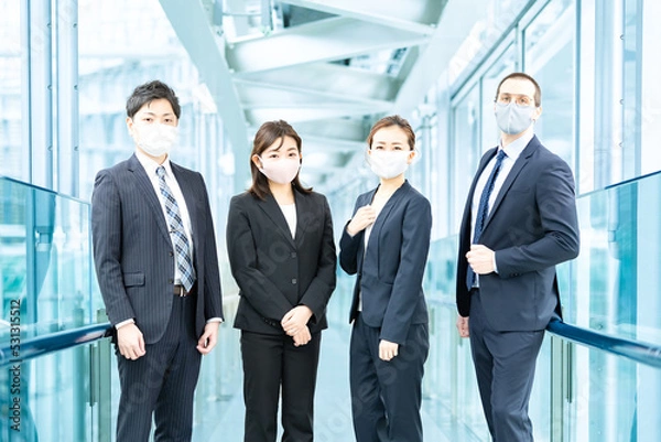 Fototapeta マスクを装着したビジネスチーム 