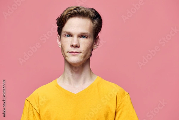 Obraz cute man posing in yellow tank top on pink background