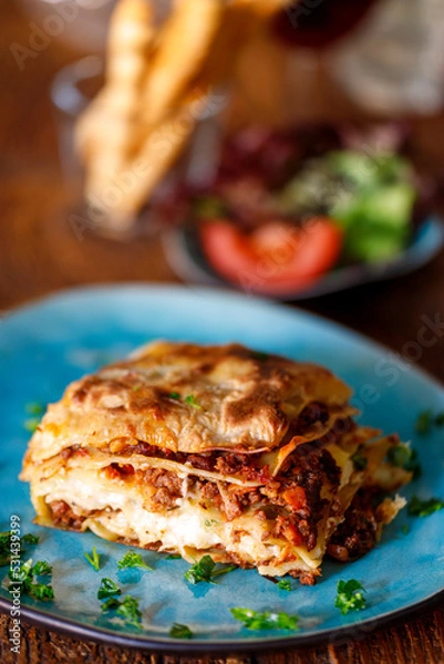 Obraz lasagna on a blue plate