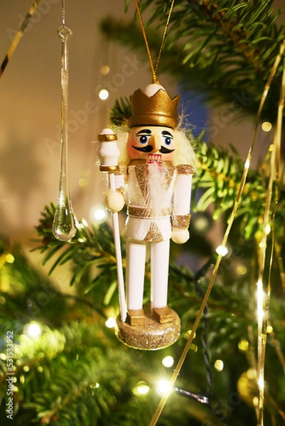 Obraz nutcracker as christmas decoration on a tree