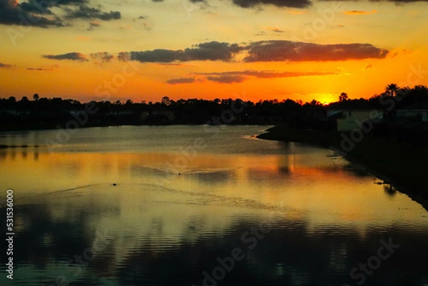 Fototapeta sunset over the river