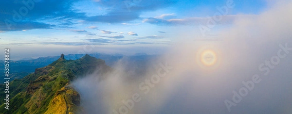 Fototapeta sunrise over clouds 