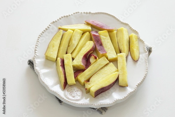 Fototapeta micro-wave cooked sweet potato on white plate for cooking image 