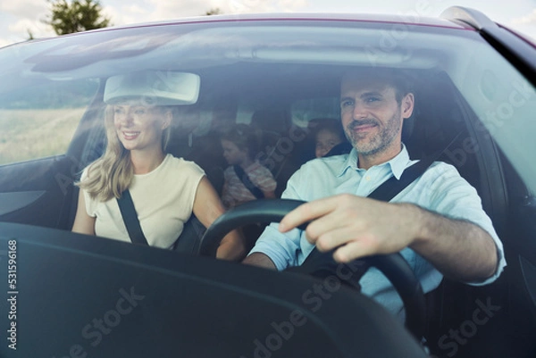 Obraz Caucasian family trip driving at the car