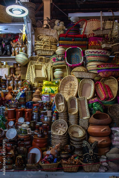 Fototapeta Sale of wicker baskets and various decorative items in the market of San Pedro, Cusco, Peru. 