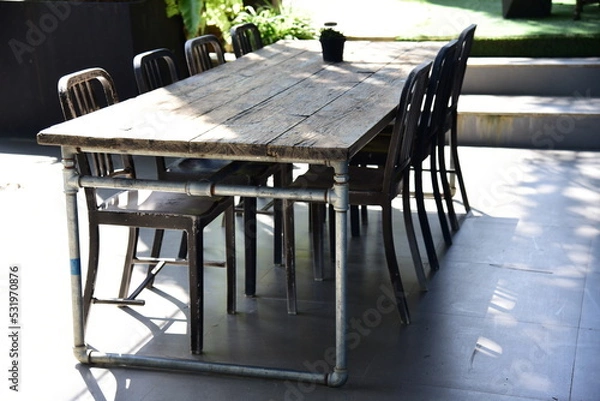 Obraz Table and chairs in outdoor cafe near  the garden.