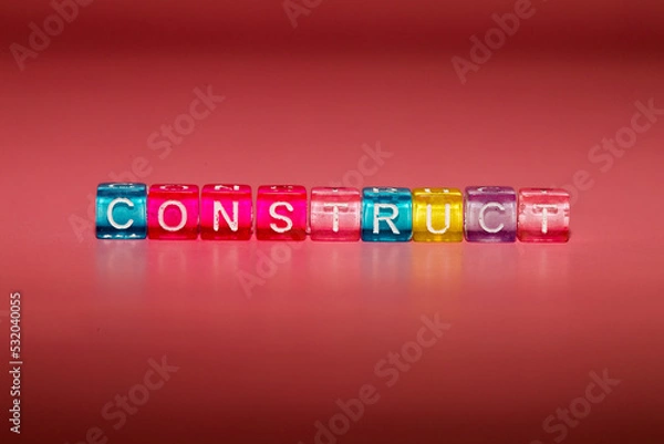 Fototapeta the word "construct" made up of cubes