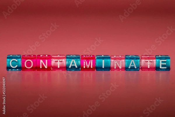 Fototapeta the word "contaminate" made up of cubes