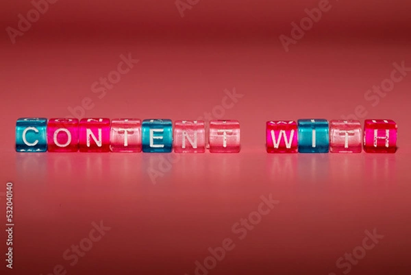 Fototapeta the word "content with" made up of cubes