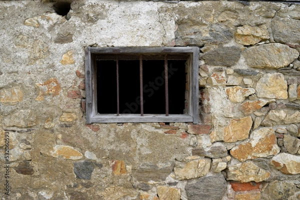 Obraz Old stone and windows with bars