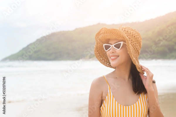 Fototapeta Young Beautiful woman in Bikini enjoying and relaxing on the beach,  Summer, vacation, holidays, Lifestyles concept.