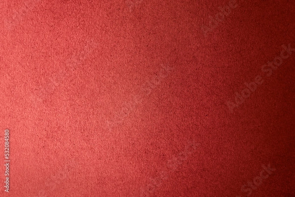 Fototapeta Solid dark red color gradation with light shade paint on craft recycled corrugated cardboard or fiberboard box paper texture background with space