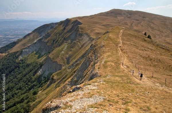 Fototapeta Tourists ascending Colomby de Gex, Jura mountains, France