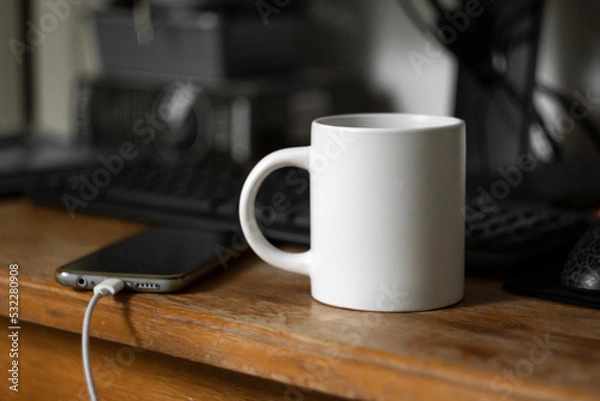 Fototapeta White mug on the desktop