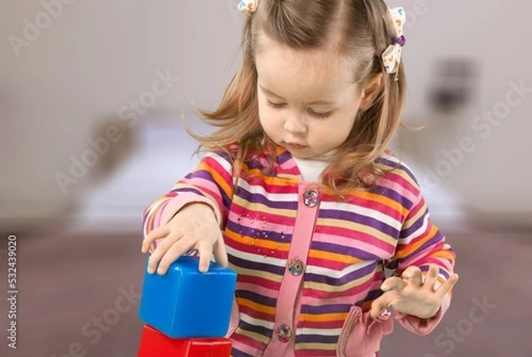 Fototapeta Child playing and studying alone at the room