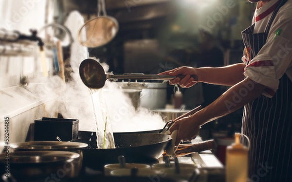 Fototapeta Chef stir fry cooking