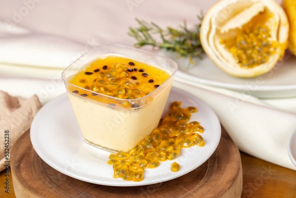 Fototapeta delicious passion fruit mousse in a rustic setting.