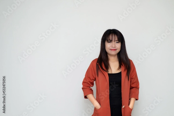 Obraz close up attractive adult business woman asian girl with happy and smile against white concrete wall office with concrete background and blank copy space.