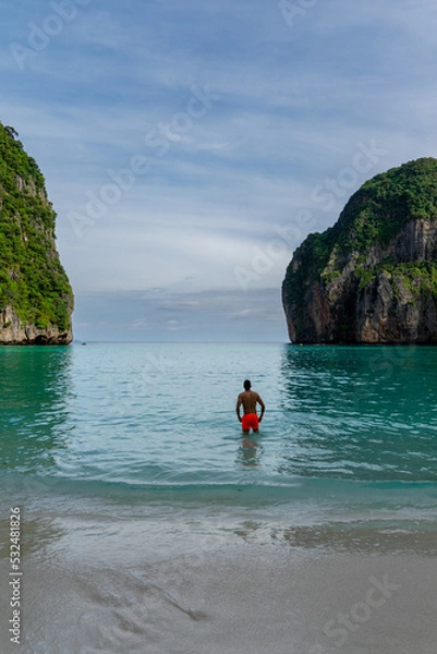 Fototapeta Boy lying on the sand at Maya Bay on Phi Phi Island in Thailand. Trip. Paradise