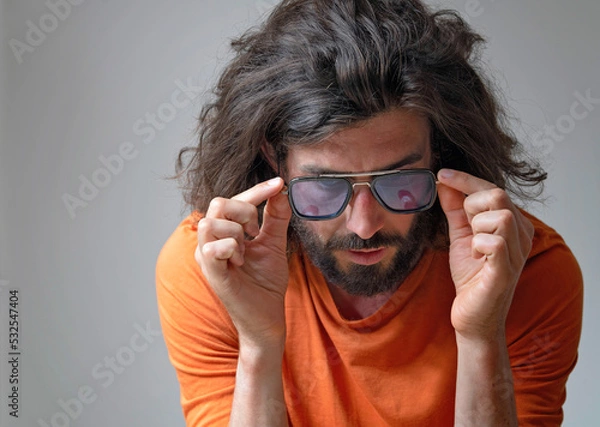 Fototapeta Young man wearing sunglasses in studio