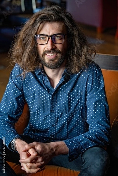 Fototapeta Young professional man at work wearing glasses