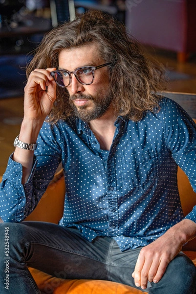 Fototapeta Young professional man at work wearing glasses