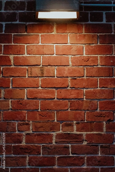 Obraz red brick wall under light