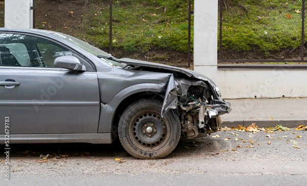 Fototapeta Crashed car in the accident on the city street.