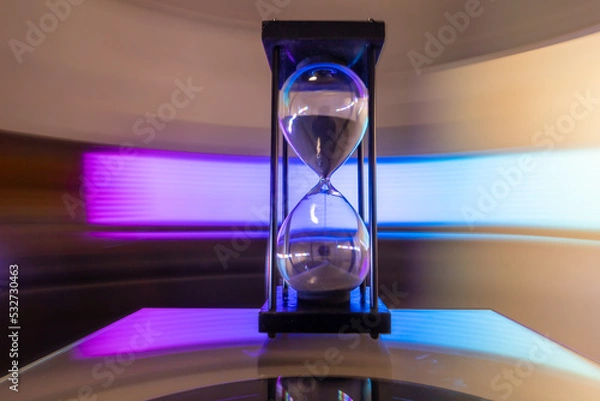 Obraz Hourglass moving fast light background.