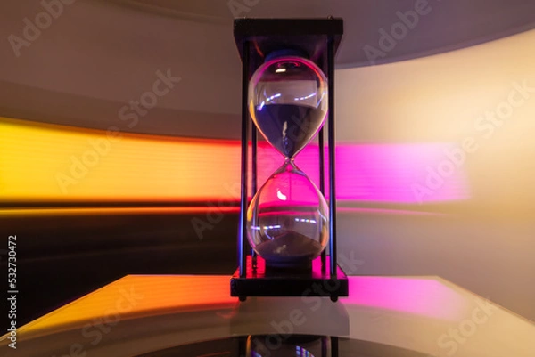 Obraz Hourglass moving fast light background.