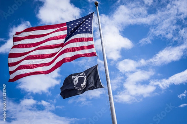 Fototapeta American and Pow flags waiving in wind