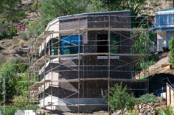 Fototapeta New home construction surrounded by trees Agoura Hills California 