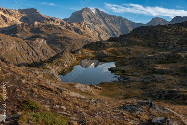 Fototapeta In the early morning and in good weather, the arrival on the Bellecombe lake in the heart of the Vanoise national park in the Alps is a wonderful moment