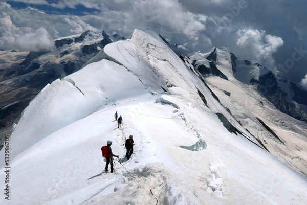 Fototapeta Multi day summer expedition through some glaciers in the alps. On the Monterosa massif starting from Zermatt and summiting multiple 4000m mountains