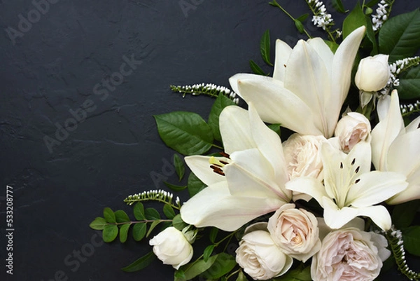 Fototapeta White delicate lily flowers composition, condolence flower background card, funeral concept image, selective focus, shallow DOF