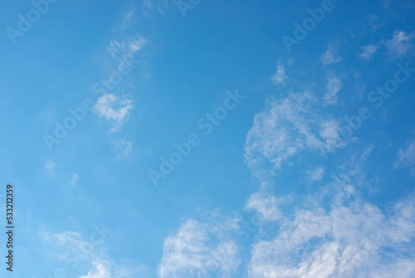 Fototapeta White clouds in a high blue sky