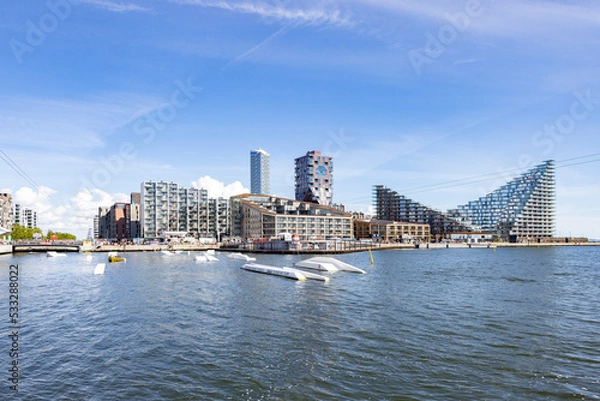Fototapeta Denmark's tallest building 40-storey tower block - Aarhus’ architectural landmarks,most significant buildings in Denmark. Aarhus is a city for architecture lovers., In Aarhus old harbor,Denmark,Europe