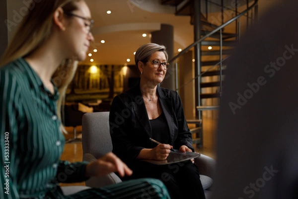 Fototapeta Female executive using digital tablet in office