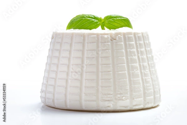 Fototapeta whole ricotta with basil leaf on a white background