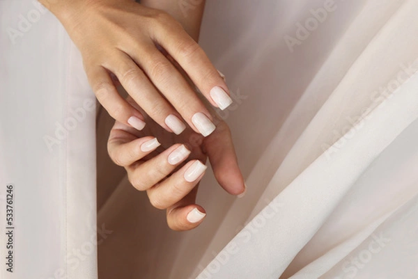 Obraz Light milky manicure on square shaped nails.